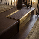 Solid brass stair nosing 71mm raked back in polished brass with peat castellated insert fitted on a dark oak hotel stairwell
