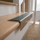 Solid Brass Stair Nosing 71mm Tread Square Front Slimline in Antique Brass finish with Spruce Castellated insert fitted on a residential oak staircase