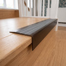 Solid Brass Stair Nosing 71mm Tread Square Front Slimline in Antique Bronze finish with Flint Castellated insert fitted on a residential oak staircase
