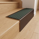 Solid Brass Stair Nosing 71mm Tread Square Front Slimline in Antique Bronze finish with Spruce Castellated insert fitted on a residential oak staircase