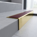 Solid Brass Stair Nosing 71mm Tread Square Front Slimline in Polished Brass finish with Claret Castellated insert fitted on a modern office reception staircase with porcelain tile treads