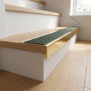 Solid Brass Stair Nosing 71mm Tread Square Front Slimline in Polished Brass finish with Spruce Castellated insert fitted on a residential oak staircase