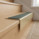 Solid Brass Stair Nosing 71mm Tread Square Front Slimline in Satin Brass finish with Spruce Castellated insert fitted on a residential oak staircase