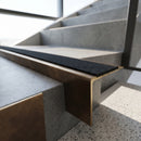 Solid Brass Stair Nosing 71mm Tread Raked Back Single Channel in antique bronze finish fitted on a step edge