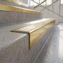 Solid Brass Stair Nosing 71mm Tread Raked Back Single Channel in polished brass finish fitted on a step edge