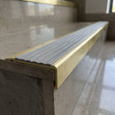Solid Brass Stair Nosing 71mm Tread Square Front Single Channel in satin brass finish fitted on a step edge