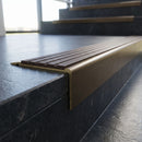 Solid Brass Stair Nosing 71mm Tread Square Front Slimline in antique bronze finish fitted on a step edge
