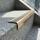 Solid Brass Stair Nosing 83mm x 55mm Ramped Heavy Duty with Carborundum Insert professionally fitted in use