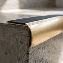Close-up of the raked back brass nosing showing the anti-slip infill