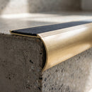 Solid Brass Stair Nosing with Anti-Slip Carborundum Infill, Raked Back Profile professionally fitted in use