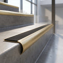 Solid Brass Stair Nosing with Anti-Slip Carborundum Infill, Raked Back Profile professionally fitted in use