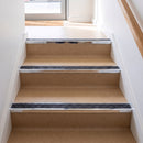 Square edge aluminium stair nosing with a dark charcoal Mor Grip insert in bright polished finish fitted on a shop or office entrance stair finished in beige lino