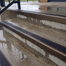 Square edge aluminium stair nosing with black gritted exterior grip insert in dark bronze finish fitted on covered external concrete steps