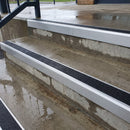 Square edge aluminium stair nosing with black gritted exterior grip insert in mill finish finish fitted on covered external concrete steps