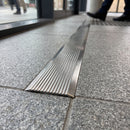 Stainless Steel Tactile Stair Nosing for Carpet and LVT Floors professionally fitted in use