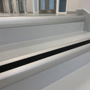 Anti-slip aluminium stair nosing fitted to two painted steps at a commercial entrance stairway