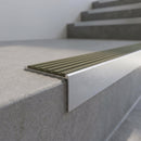 Slimline 59x30mm square back aluminium stair nosing with an olive khaki ribbed PVC insert, on a satin aluminium bar, fitted along the front edge of a concrete step