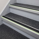60x55mm aluminium stair nosing with black insert and green glow strip fitted to carpeted office stairs