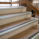 60x55mm aluminium stair nosing with brown insert and green glow strip fitted to oak-effect library stairs