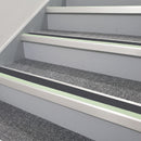 60x55mm aluminium stair nosing with Midnight Grey insert and green glow strip fitted to transport interchange stairs