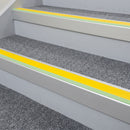 60x55mm aluminium stair nosing with yellow insert and green glow strip fitted to communal housing stairs