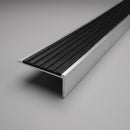 Square front stair nosing, 63.3mm tread with a black ribbed insert band, shown on a plain studio background