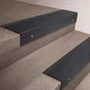 Black Anodised finish 66x55mm raked back aluminium stair nosing with a Black Smooth Textured insert, fitted to interior steps