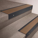 Black Anodised finish 66x55mm raked back aluminium stair nosing with a Bronze Aluminium insert, fitted to interior steps