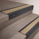 Black Anodised finish 66x55mm raked back aluminium stair nosing with a Light Bronze Aluminium insert, fitted to interior steps