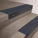 Black Anodised finish 66x55mm raked back aluminium stair nosing with a Mid Blue Castellated insert, fitted to interior steps