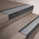 Black Anodised finish 66x55mm raked back aluminium stair nosing with a Mill Aluminium insert, fitted to interior steps