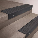 Black Anodised finish 66x55mm raked back aluminium stair nosing with a Nimbus Castellated insert, fitted to interior steps