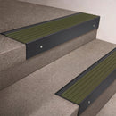 Black Anodised finish 66x55mm raked back aluminium stair nosing with a Olive Castellated insert, fitted to interior steps