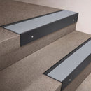 Black Anodised finish 66x55mm raked back aluminium stair nosing with a Polar Grey Smooth Textured insert, fitted to interior steps