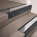 Black Anodised finish 66x55mm raked back aluminium stair nosing with a Polished Aluminium insert, fitted to interior steps