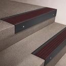 Black Anodised finish 66x55mm raked back aluminium stair nosing with a Regency Castellated insert, fitted to interior steps