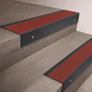 Black Anodised finish 66x55mm raked back aluminium stair nosing with a Rustic Castellated insert, fitted to interior steps