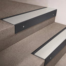 Black Anodised finish 66x55mm raked back aluminium stair nosing with a Satin Aluminium insert, fitted to interior steps
