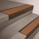 Bronze finish 66x55mm raked back aluminium stair nosing with a Fawn Castellated insert, fitted to interior steps