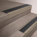 Light Bronze finish 66x55mm raked back aluminium stair nosing with a Black Anodised Aluminium insert, fitted to interior steps
