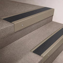 Light Bronze finish 66x55mm raked back aluminium stair nosing with a Black Anodised Aluminium insert, fitted to interior steps