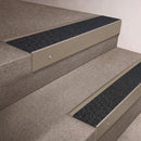 Light Bronze finish 66x55mm raked back aluminium stair nosing with a Black Olympic Grip insert, fitted to interior steps