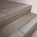 Light Bronze finish 66x55mm raked back aluminium stair nosing with a Mill Aluminium insert, fitted to interior steps