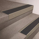 Light Bronze finish 66x55mm raked back aluminium stair nosing with a Nimbus Castellated insert, fitted to interior steps