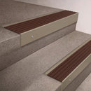 Light Bronze finish 66x55mm raked back aluminium stair nosing with a Peat Castellated insert, fitted to interior steps