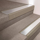 Light Bronze finish 66x55mm raked back aluminium stair nosing with a Polished Aluminium insert, fitted to interior steps