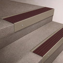Light Bronze finish 66x55mm raked back aluminium stair nosing with a Regency Castellated insert, fitted to interior steps