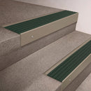 Light Bronze finish 66x55mm raked back aluminium stair nosing with a Spruce Castellated insert, fitted to interior steps