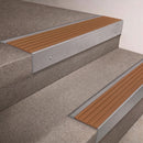 Mill Aluminium finish 66x55mm raked back aluminium stair nosing with a Fawn Castellated insert, fitted to interior steps