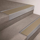 Mill Aluminium finish 66x55mm raked back aluminium stair nosing with a Light Bronze Aluminium insert, fitted to interior steps